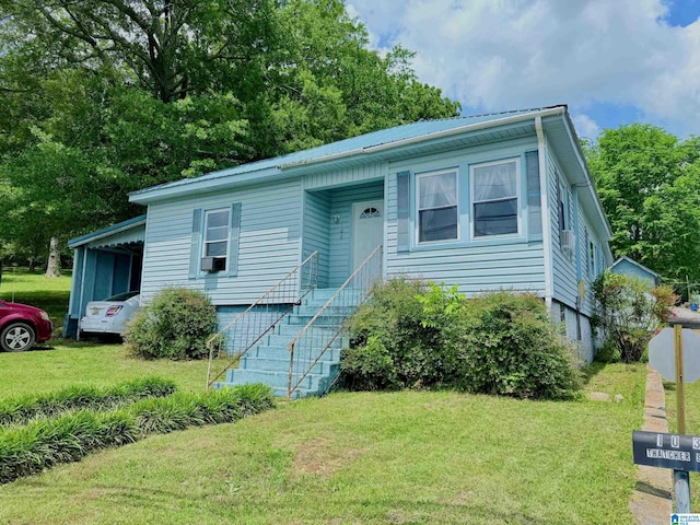 103 Thatcher St, Piedmont, AL 36272 - view of front of property with stairway, cooling unit, metal roof, and a front lawn