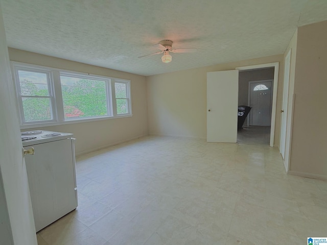 103 Thatcher St, Piedmont, AL 36272 - empty room featuring baseboards, a ceiling fan, and a textured ceiling