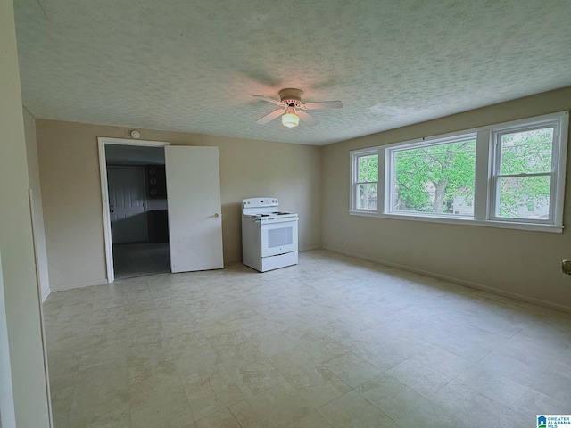 103 Thatcher St, Piedmont, AL 36272 - unfurnished room with baseboards, a ceiling fan, and a textured ceiling