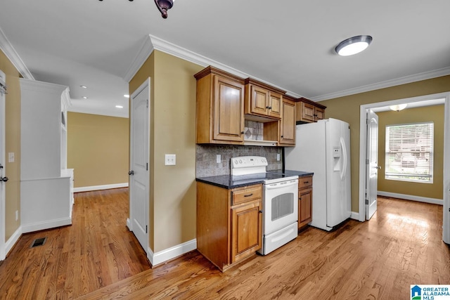 kitchen featuring crown molding, light wood-style floors, visible vents, and white appliances