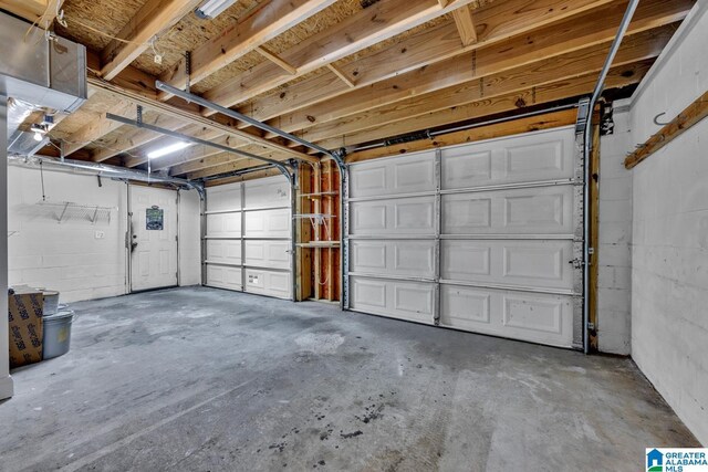 garage with concrete block wall