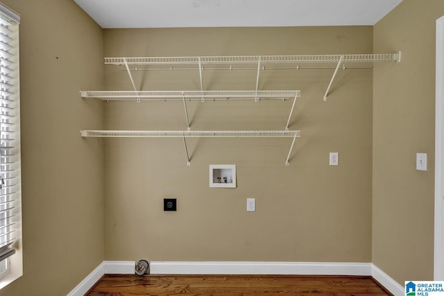 washroom with washer hookup, laundry area, baseboards, wood finished floors, and hookup for an electric dryer