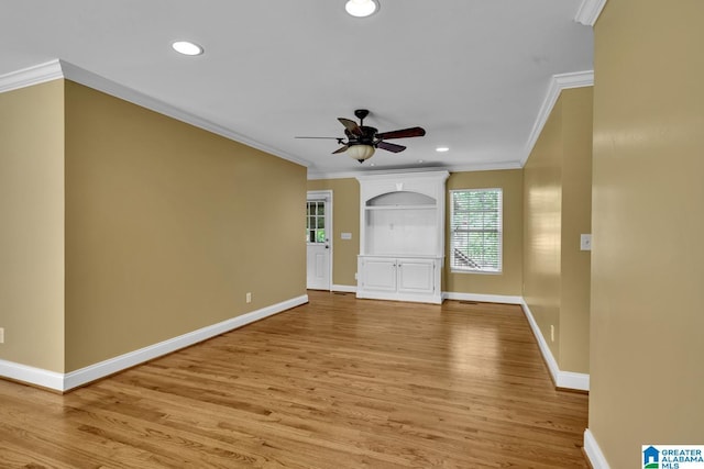 entryway with crown molding, a ceiling fan, baseboards, and light wood-type flooring