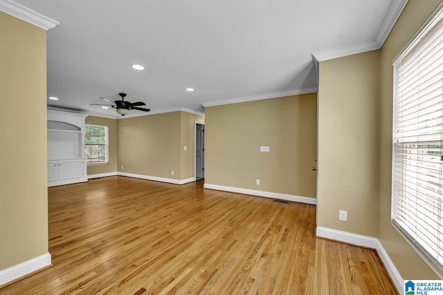 spare room with crown molding, recessed lighting, a ceiling fan, and light wood finished floors
