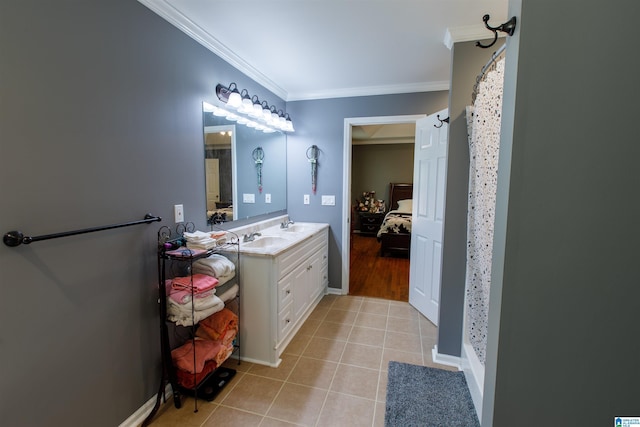 ensuite bathroom featuring tile patterned flooring, curtained shower, vanity, ornamental molding, and ensuite bath
