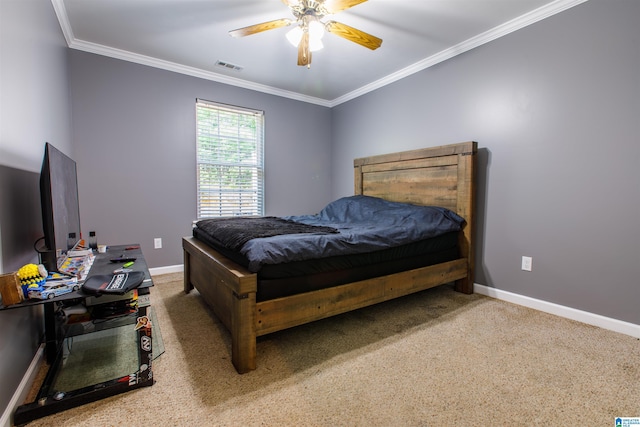 carpeted bedroom featuring a ceiling fan, baseboards, visible vents, and ornamental molding
