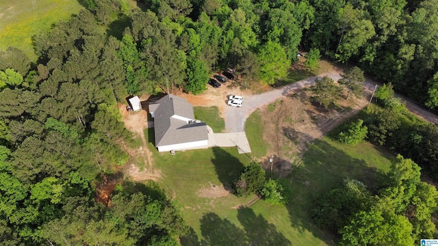 drone / aerial view featuring a forest view