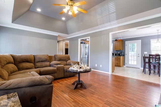 living area featuring ornamental molding, baseboards, ceiling fan, recessed lighting, and light wood-style flooring