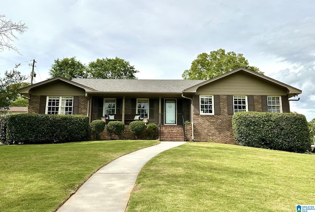 1836 Canton Rd, Vestavia Hills, AL 35216 - ranch-style house with brick siding and a front yard