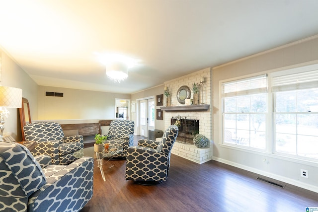 1836 Canton Rd, Vestavia Hills, AL 35216 - living room featuring dark wood finished floors, a brick fireplace, baseboards, and crown molding