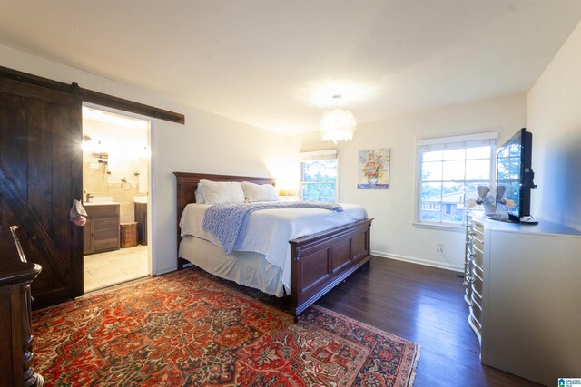 1836 Canton Rd, Vestavia Hills, AL 35216 - bedroom featuring dark wood-style floors, ensuite bath, baseboards, and a barn door
