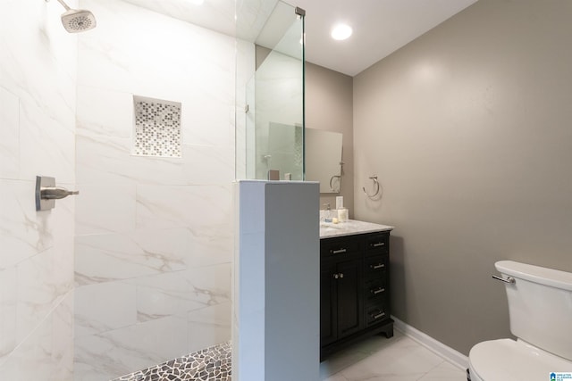 1836 Canton Rd, Vestavia Hills, AL 35216 - bathroom featuring tiled shower, toilet, marble look tile flooring, vanity, and baseboards