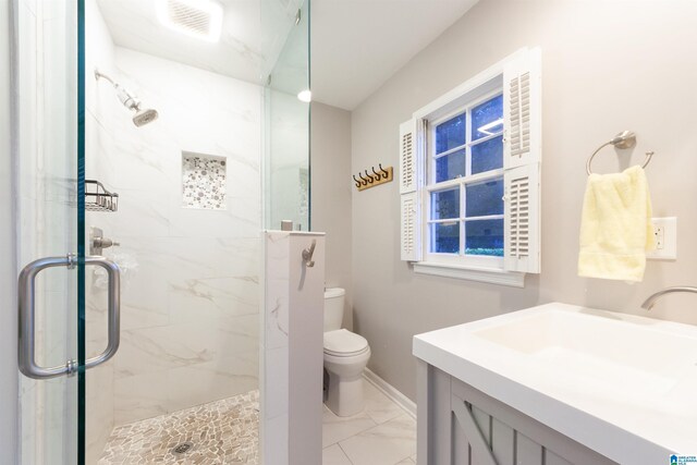 1836 Canton Rd, Vestavia Hills, AL 35216 - full bathroom featuring a marble finish shower, marble look tile flooring, toilet, baseboards, and vanity
