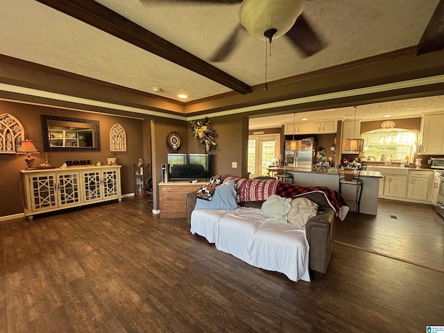 1525 Marvin Adcock Rd, Hayden, AL 35079 - living room featuring a textured ceiling, crown molding, a ceiling fan, plenty of natural light, and beamed ceiling