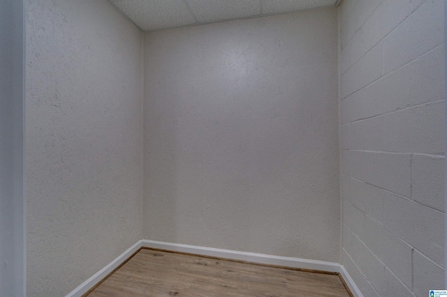 unfurnished room with baseboards and wood finished floors