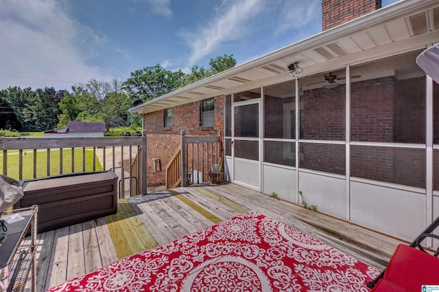 wooden deck with a sunroom