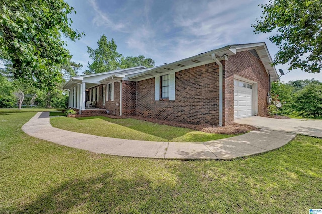 view of property exterior with a garage, a lawn, concrete driveway, and brick siding
