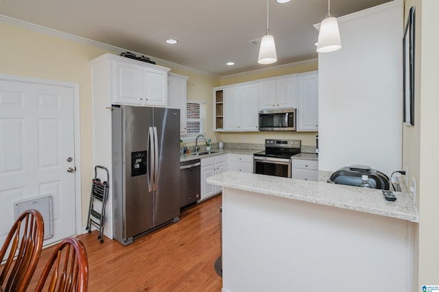 kitchen with crown molding, open shelves, a peninsula, a sink, and stainless steel appliances