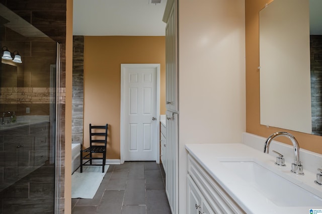 bathroom featuring vanity, tile patterned flooring, and a stall shower
