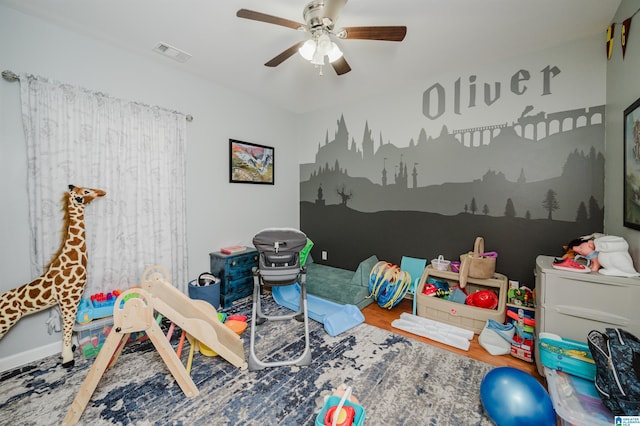 game room featuring ceiling fan, wood finished floors, and visible vents