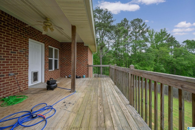 wooden deck with a ceiling fan