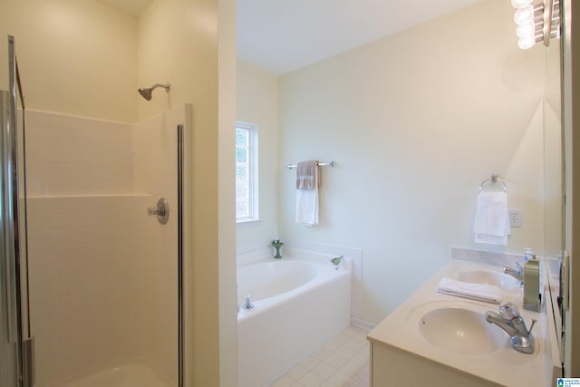 full bathroom with a sink, double vanity, a shower stall, and a bath