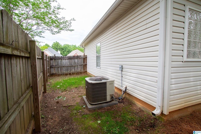 view of property exterior featuring a fenced backyard and central air condition unit