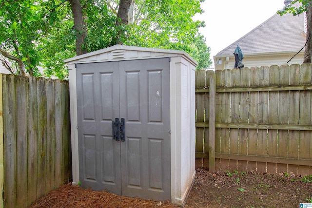 view of shed with a fenced backyard