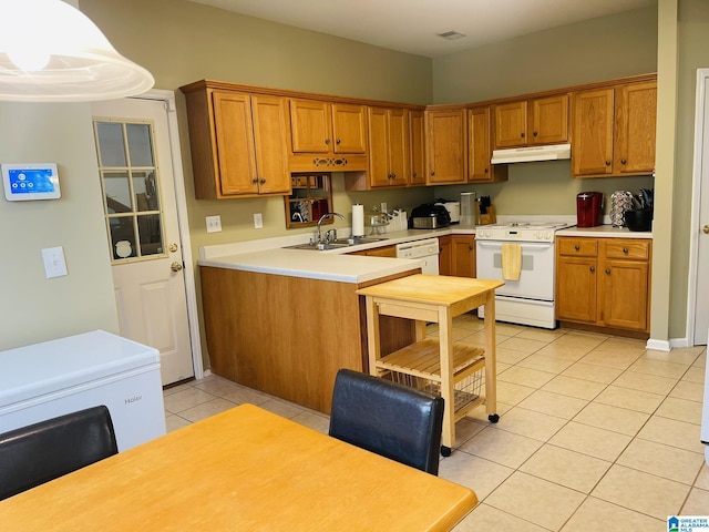 196 King James Ct, Alabaster, AL 35007 - kitchen featuring white appliances, under cabinet range hood, light tile patterned floors, and brown cabinets