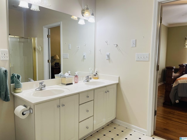 196 King James Ct, Alabaster, AL 35007 - full bathroom featuring ensuite bath, ornamental molding, a shower stall, baseboards, and double vanity