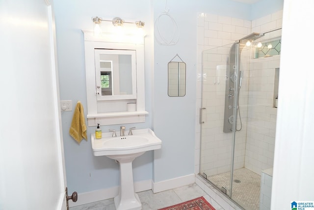 full bath featuring baseboards and a shower stall