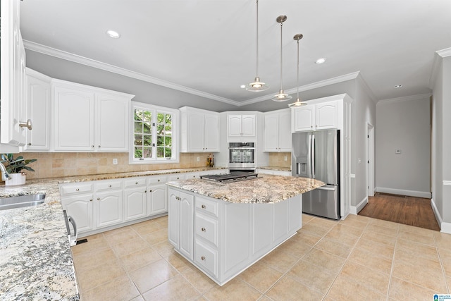 2074 Royal Fern Ln, Hoover, AL 35244 - kitchen with appliances with stainless steel finishes, a center island, a sink, light tile patterned floors, and white cabinetry