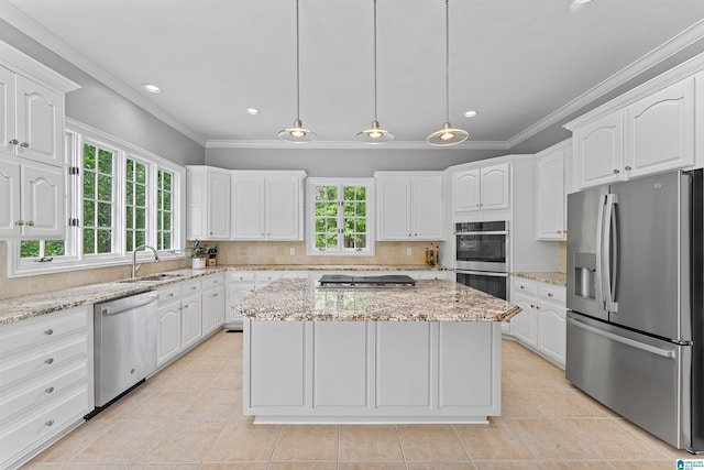 2074 Royal Fern Ln, Hoover, AL 35244 - kitchen with crown molding, appliances with stainless steel finishes, light tile patterned floors, a sink, and white cabinetry