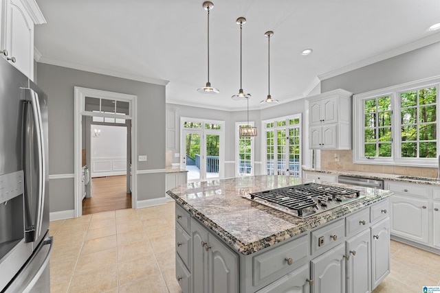 2074 Royal Fern Ln, Hoover, AL 35244 - kitchen with crown molding, recessed lighting, appliances with stainless steel finishes, and light tile patterned floors