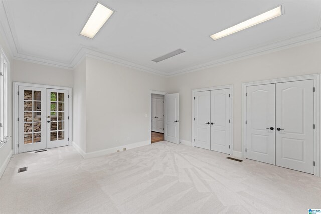 2074 Royal Fern Ln, Hoover, AL 35244 - unfurnished bedroom with crown molding, carpet flooring, french doors, two closets, and baseboards
