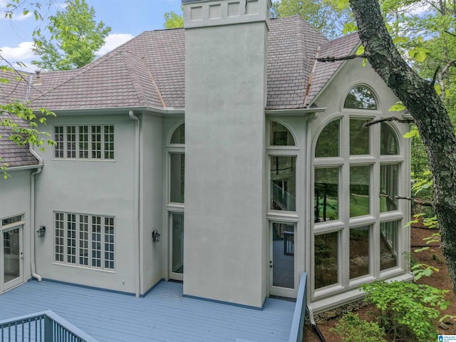 2074 Royal Fern Ln, Hoover, AL 35244 - rear view of house featuring stucco siding, a chimney, and a deck