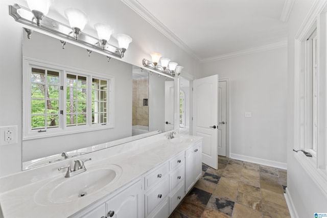 2074 Royal Fern Ln, Hoover, AL 35244 - bathroom with double vanity, a sink, stone finish flooring, and ornamental molding