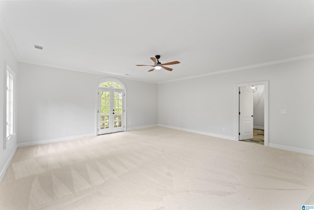 2074 Royal Fern Ln, Hoover, AL 35244 - spare room with visible vents, ornamental molding, a ceiling fan, and light colored carpet