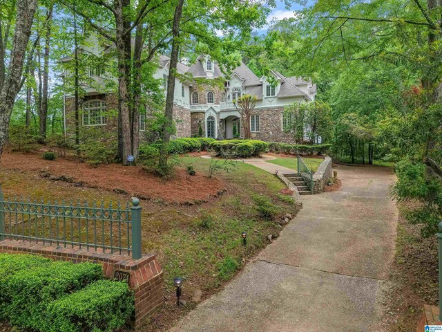 2074 Royal Fern Ln, Hoover, AL 35244 - view of front facade with fence and stone siding