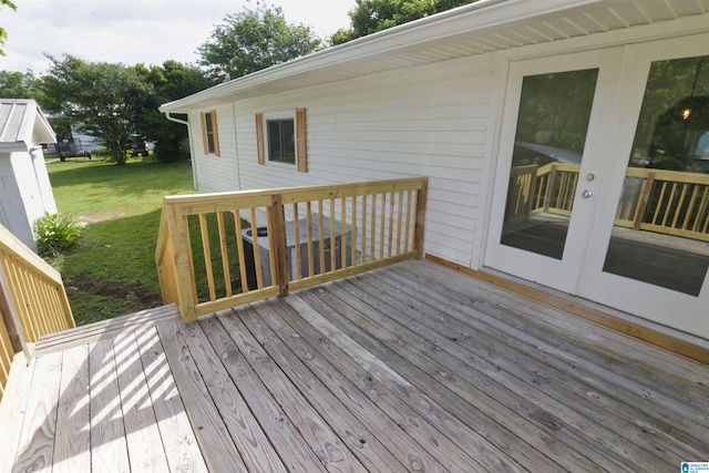 wooden deck with a lawn