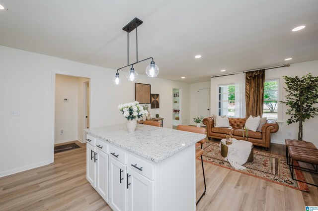 209 Nabors Ave, Hueytown, AL 35023 - kitchen with light wood-style floors, a kitchen island, recessed lighting, and open floor plan