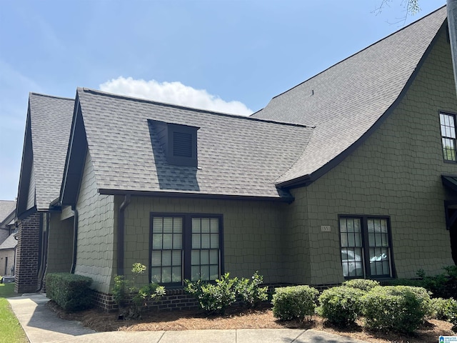 view of front of home with a shingled roof