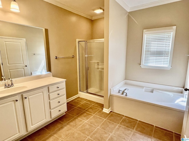bathroom with crown molding, a shower stall, a garden tub, and vanity