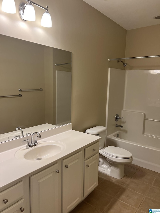 bathroom with vanity, tile patterned flooring, shower / bathtub combination, and toilet