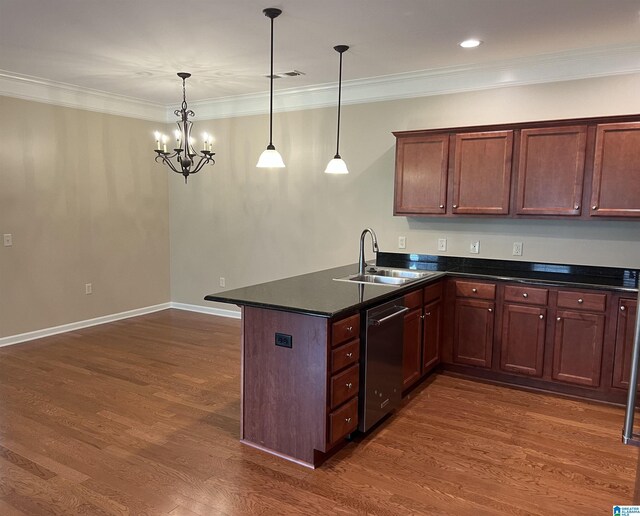 kitchen featuring dark countertops, a sink, dishwasher, a peninsula, and dark wood-type flooring