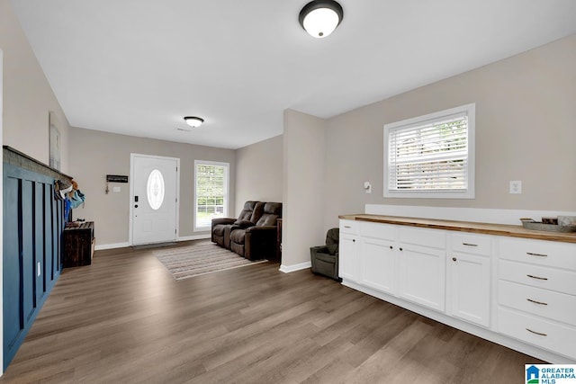 interior space featuring baseboards and light wood-style flooring