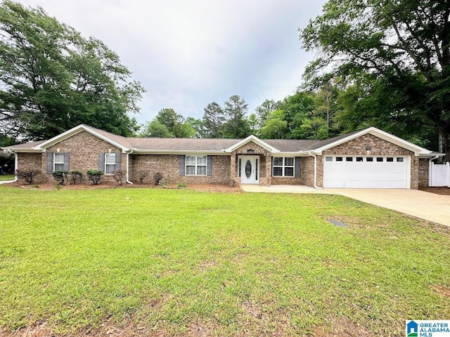 single story home with brick siding, a garage, a front yard, and concrete driveway