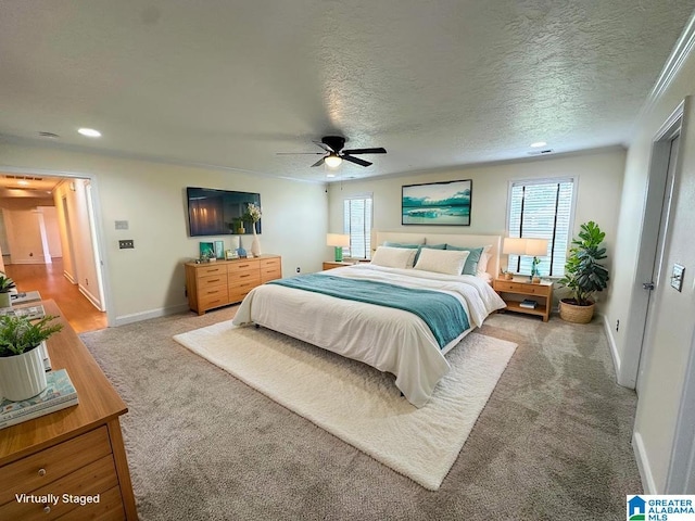 bedroom with baseboards, ceiling fan, recessed lighting, a textured ceiling, and carpet