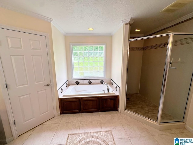 full bathroom with crown molding, a textured ceiling, tile patterned floors, a shower stall, and a garden tub