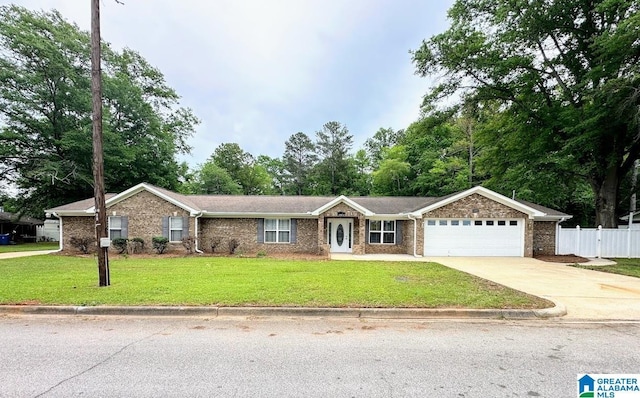 ranch-style house featuring driveway, a front yard, brick siding, fence, and an attached garage